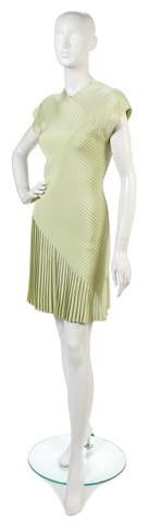 A Bill Blass Green Silk Dress,: A Bill Blass Green Silk Dress, with diagonal textured seams, pleated asymmetric skirt. Labeled: Bill Blass.