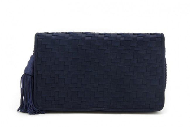 A Judith Leiber Navy Woven Silk Clutch, 8 1/2 x 5: A Judith Leiber Navy Woven Silk Clutch, with matching rope strap. Stamped: Judith Leiber. 8 1/2 x 5 inches. Property from the Collection of Beverly B. Bernstein, Washington, D.C.