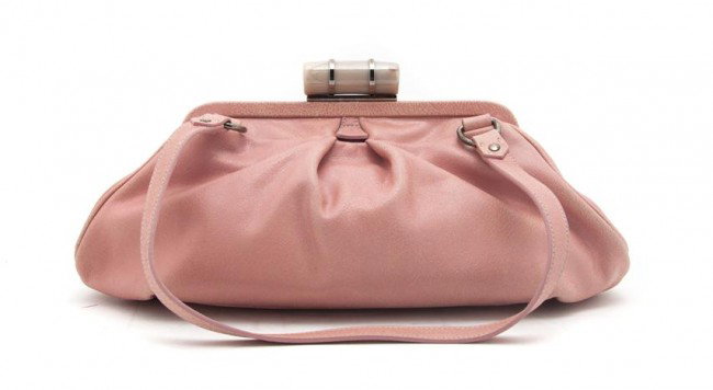 A Miu Miu Pink Distressed Leather Bag. 14 x 5 inch: A Miu Miu Pink Distressed Leather Bag. Stamped: Miu Miu. 14 x 5 inches. Property from the Estate of Naomi T. Borwell, Chicago, Illinois