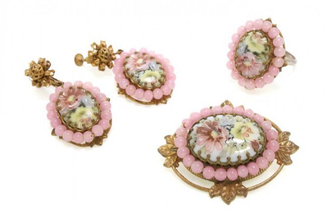 A Miriam Haskell Pink Beaded Floral Suite,: A Miriam Haskell Pink Beaded Floral Suite, comprised of a brooch, ring and earclips in a cameo motif. Stamped: Miriam Haskell. Property from the Di Santacroce Collection, Palm Beach, Florida