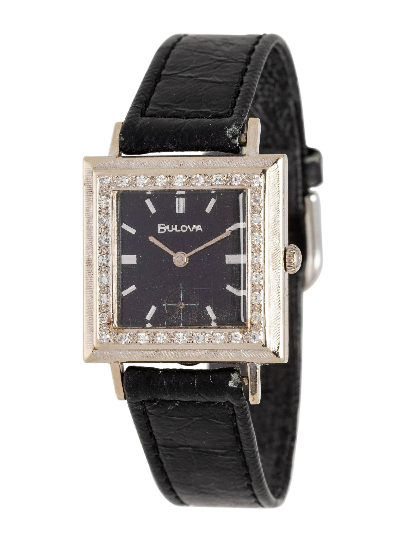 BULOVA, 14K WHITE GOLD AND DIAMOND WRISTWATCH: BULOVA, 14K WHITE GOLD AND DIAMOND WRISTWATCH 28.00 x 28.00 mm case dimensions, the bezel containing numerous single cut diamonds, black dial, applied baton numerals, subdial for seconds at 6 o'clock,