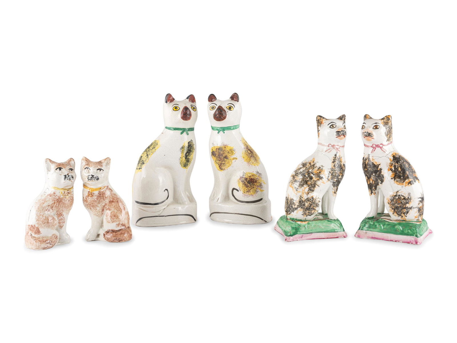 Three Pairs of Staffordshire Glazed Earthenware Cats: Three Pairs of Staffordshire Glazed Earthenware Cats English, 19th Century Height of largest 8 5/8 inches. Property from the Estate of Shirley Kay Caskey, Rochester, Minnesota