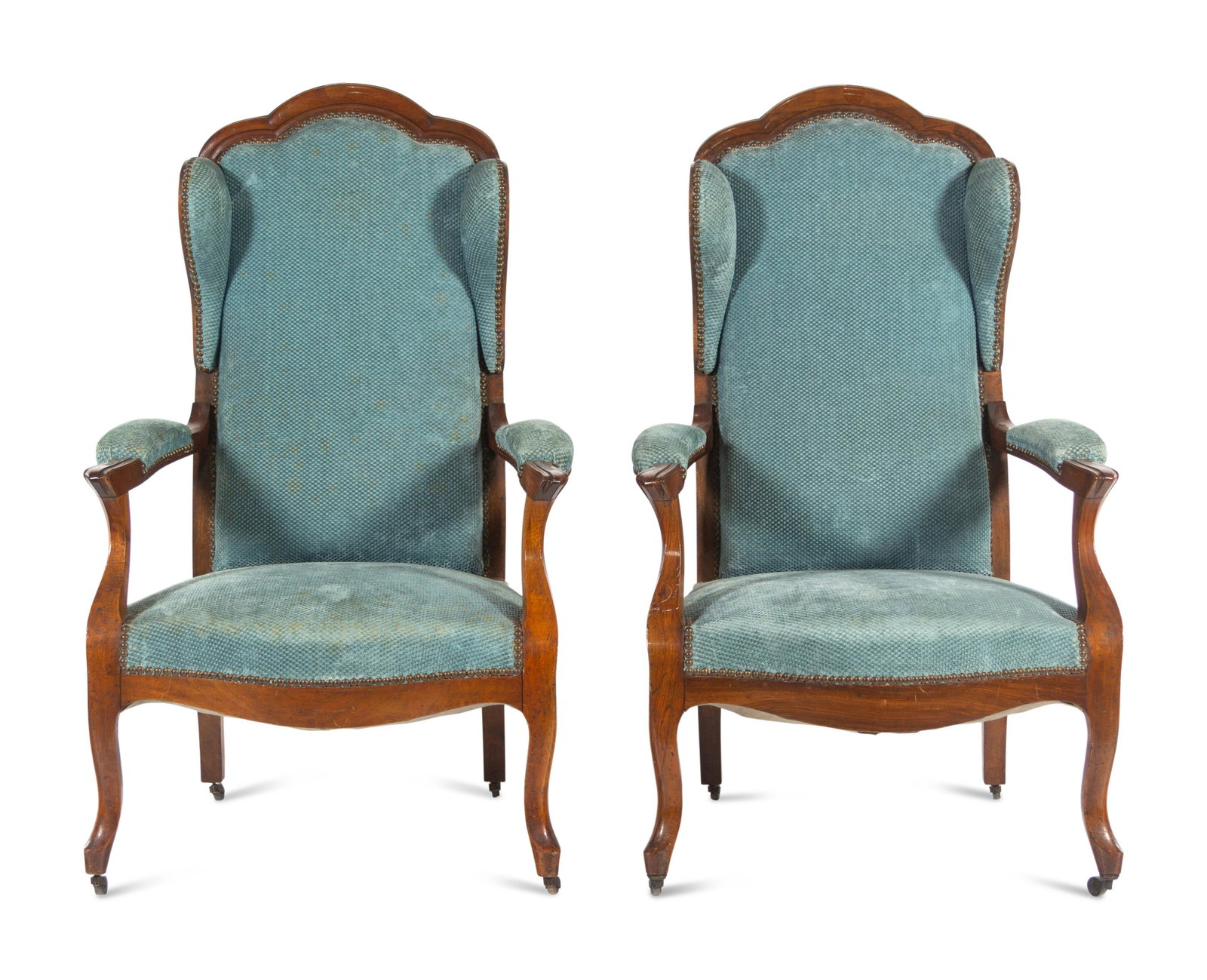 A Pair of Louis Philippe Mahogany Wingback Bergeres: A Pair of Louis Philippe Mahogany Wingback Bergeres Second Half 19th Century Height 47 x width 28 x depth 23 inches. Property from the Collection of Susan Gutfreund, New York, New York