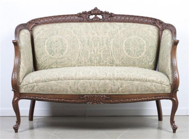 A Louis XV Style Settee, Width 54 inches.: A Louis XV Style Settee, having a Rococo carved crest above the upholstered back, arms and seat raised on cabriole legs. Width 54 inches. Property from the Estate of Naomi T. Borwell, Chicago, Illinoi