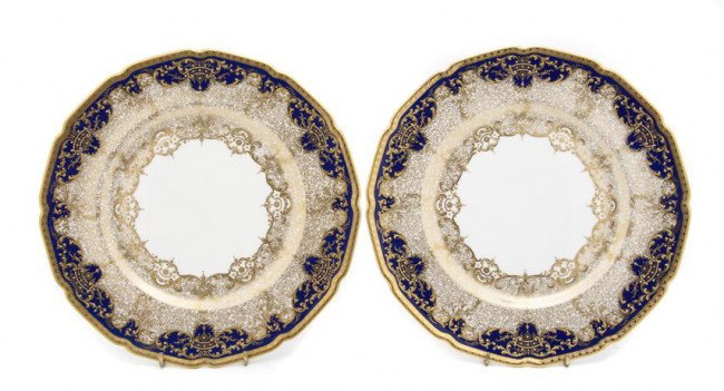 A Set of Fourteen Royal Doulton Plates, retailed b: A Set of Fourteen Royal Doulton Plates, retailed by Marshall Field and Co., having cobalt borders with gilt scrolling foliate decoration. Diameter 10 1/4 inches. Property from the Estate of Naomi T. B