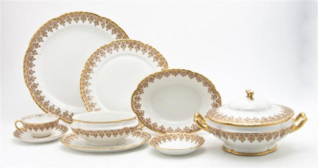 A Limoges China Service, Diameter 10 5/8 inches.: A Limoges China Service, having repeating polychrome floral decorated bands, comprising 6 dinner plates, 6 luncheon plates, 6 finger bowls, 10 bread plates, 5 dessert plates, 3 teacups and 12 saucers,