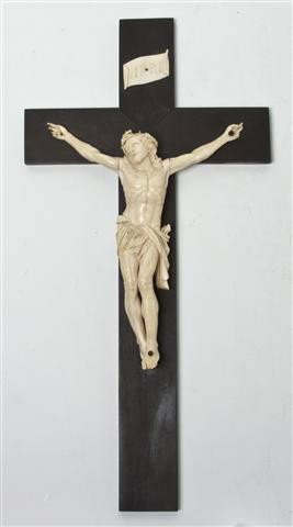 An Italian Carved Ivory and Ebonized Wood Crucifix: An Italian Carved Ivory and Ebonized Wood Crucifix, depicting Christ. Height of figure 9 1/2 inches.