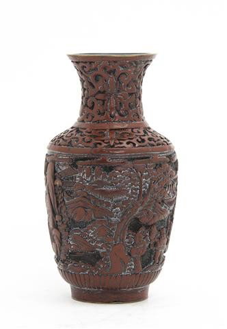 A Cinnabar Lacquer Vase, Height 6 1/4 inches.: A Cinnabar Lacquer Vase, of baluster form, having allover scrolling and landscape decoration. Height 6 1/4 inches.