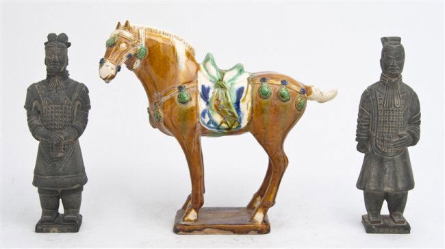 A Chinese Pottery Model of a Horse, Height of tall: A Chinese Pottery Model of a Horse, in the Tang style, together with two models of soldiers from the Terracotta Army. Height of tallest 8 1/2 inches. Property from the Estate of Naomi T. Borwell, Chic