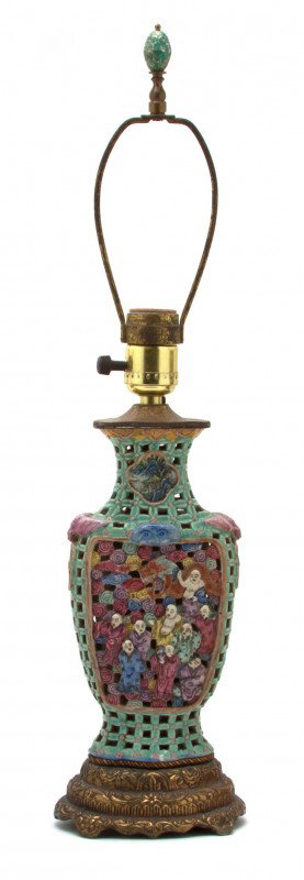 A Chinese Porcelain Vase: A Chinese Porcelain Vase, having a pierced baluster form body decorated with bats, immortals and other figures, mounted as a lamp.