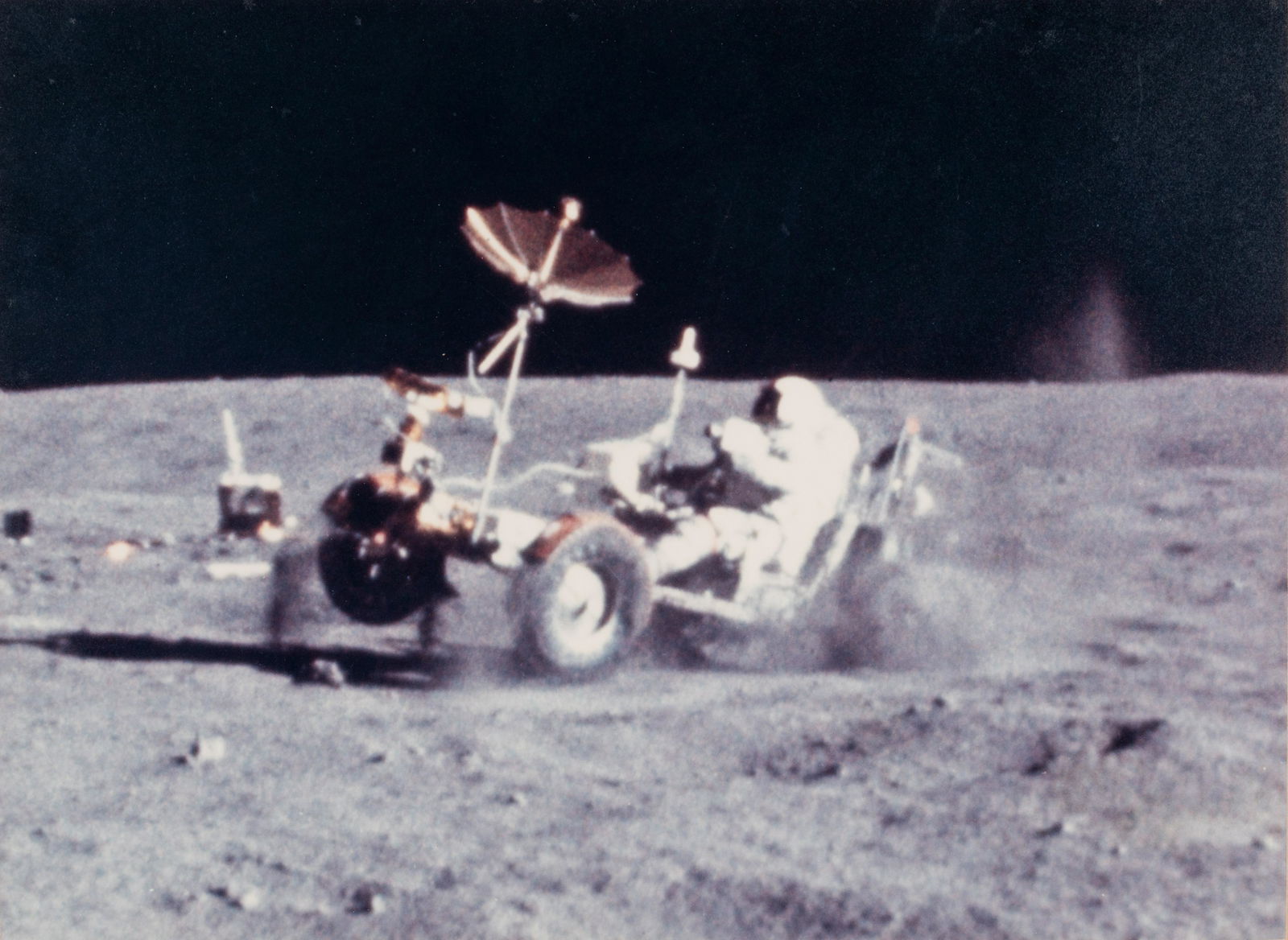 YOUNG, John Watts (1930-2018). Photograph of Young: YOUNG, John Watts (1930-2018). Photograph of Young driving a moon buggy, signed ( "John Young") to Ambassador Edward Joseph Perkins. Silver gelatin photograph, 16 July 1994, SIGNED AND INSCRIBED