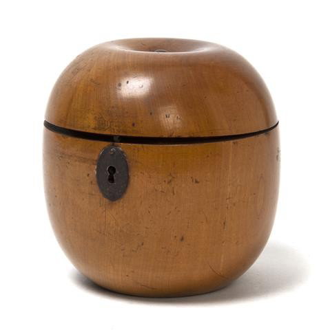 A George III Fruitwood Tea Caddy, Height 4 1/2 inche: A George III Fruitwood Tea Caddy, 19th century, of apple form, the hinged top opening to a later metal lined interior. Height 4 1/2 inches. Property from the William H. Moore Trust, Hobe Sound, Florid