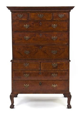 A George II Walnut Chest-on-Chest, Height 67 1/2 x : A George II Walnut Chest-on-Chest, the superstructure having a dentiled cornice over three short and three long graduated drawers, the base with two short and two long graduated drawers, raised on lat