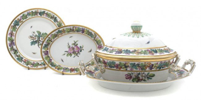 A Berlin Royal Porcelain Partial Dinner Service, W: A Berlin Royal Porcelain Partial Dinner Service, each decorated with bands of grapevines and centered with a floral spray surrounded by insects, comprising 12 plates, a lidded tureen with underplate a