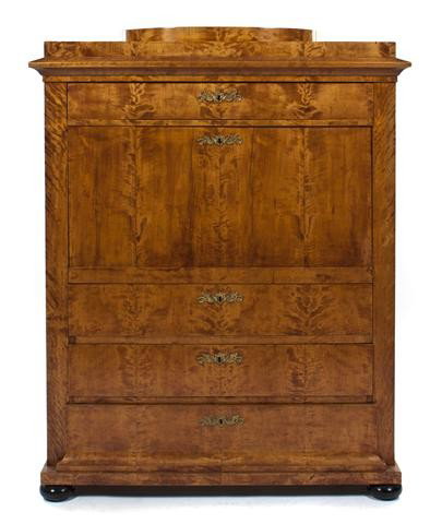 A Biedermeier Secretaire a Abattant, Height 59 x w: A Biedermeier Secretaire a Abattant, having a stepped cornice over the frieze drawer above the fall front writing surface opening to a fitted interior, above three drawers, raised on ebonized feet. He