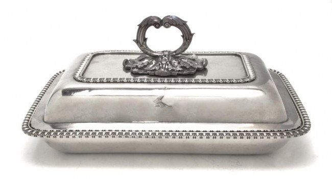 A Regency Silver Covered Entree, Width 11 1/4 inch: A Regency Silver Covered Entree, of rectangular form, with a foliate handle and gadrooned edge; approximate total weight 50.05 ozt. Width 11 1/4 inches. Property from the William H. Moore Trust, Hobe 