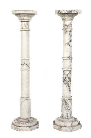 A Pair of Alabaster Columns, Height 35 1/4 inches.: A Pair of Alabaster Columns, each having a square top with canted corners over the ring turned standard, raised on an octagonal base. Height 35 1/4 inches. Property from the Estate of Medard C. Lange,
