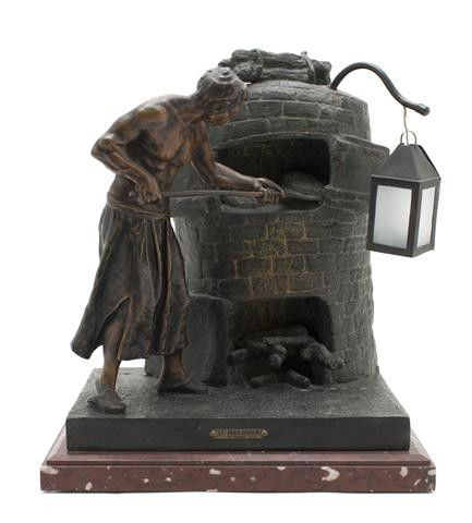 A French Cast Metal Figural Lamp, after Rousseau,: A French Cast Metal Figural Lamp, after Rousseau, cast as a baker removing a loaf from the oven, mounted on a marble plinth base. Height overall 15 1/2 inches.