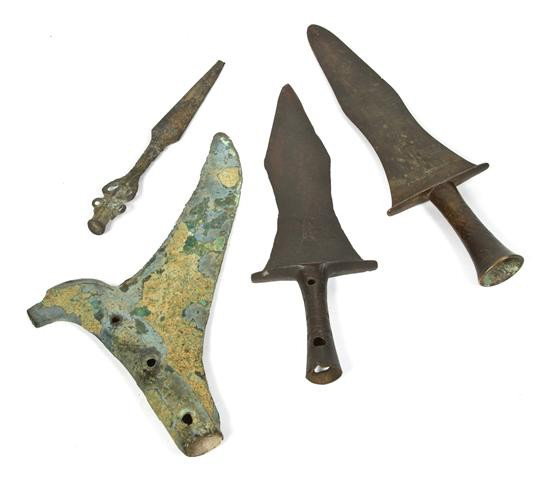A Group of Southeast Asian Bronze Articles, Height: A Group of Southeast Asian Bronze Articles, comprising two spear heads, one pike or finial with eagle head and one dagger with figural handle. Height of tallest 11 inches. Property from the Laurence R