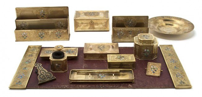 A Tiffany Studios Bronze Desk Set, Width of first: A Tiffany Studios Bronze Desk Set, in the Abalone pattern, comprising letter rack (1156), table casket (1150), blotter ends (1153), inkwell (1157), rocker blotter (1164), pen tray (1159), stamp box (1