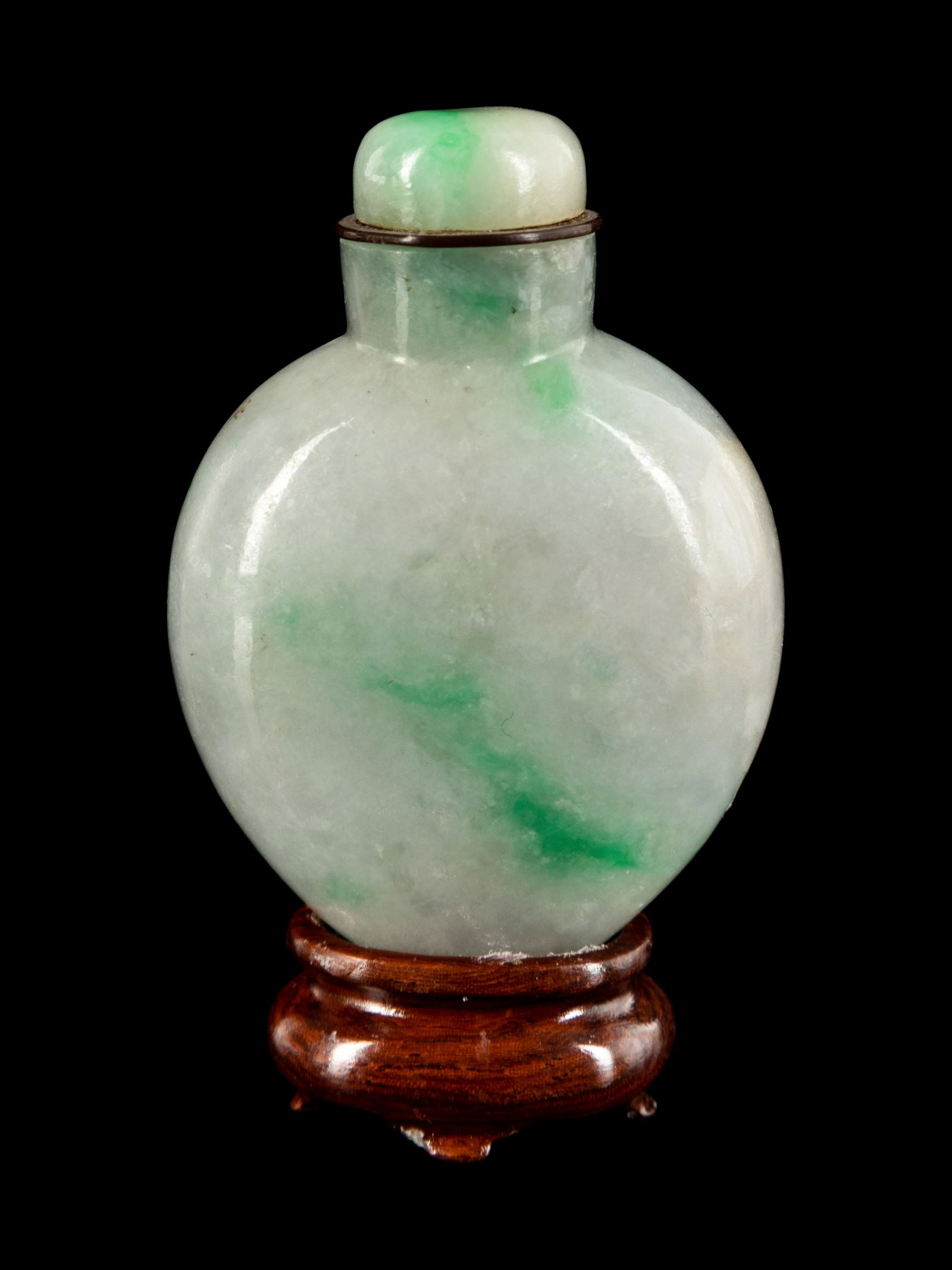 A Chinese Green and White Jadeite Snuff Bottle Height of bottle 1 7/8 in., 4.7 cm. (1 of 2)