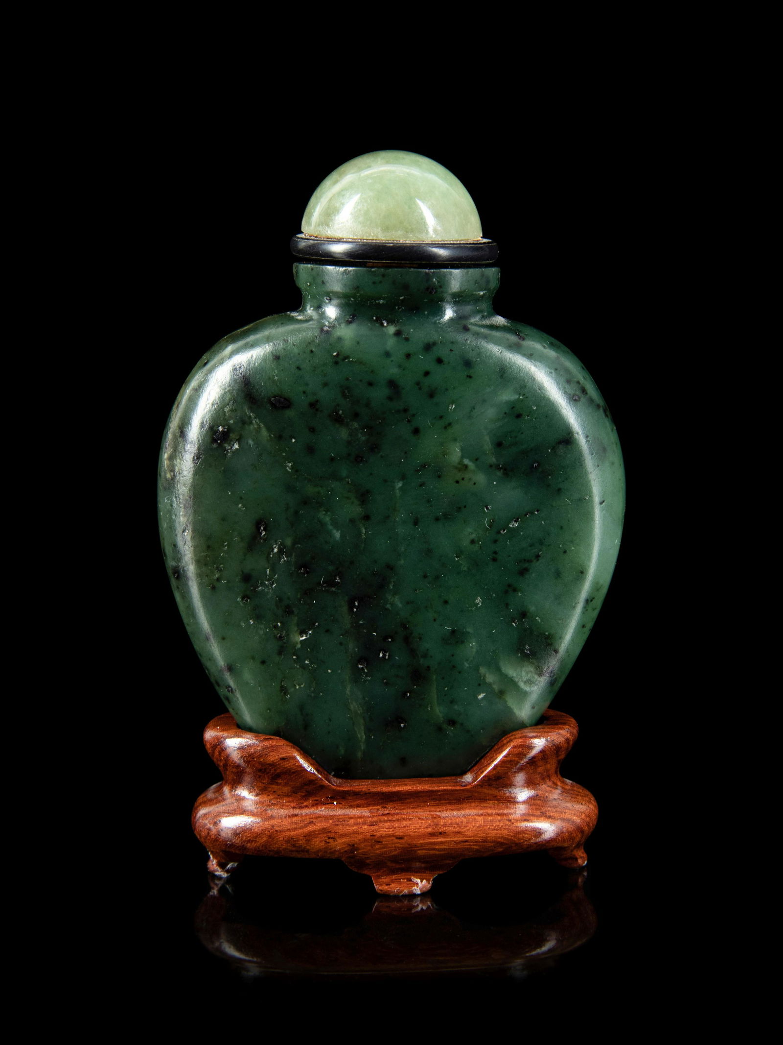 A Chinese Spinach Jade Snuff Bottle Height of bottle 2 1/2 in., 6.4 cm. (1 of 3)
