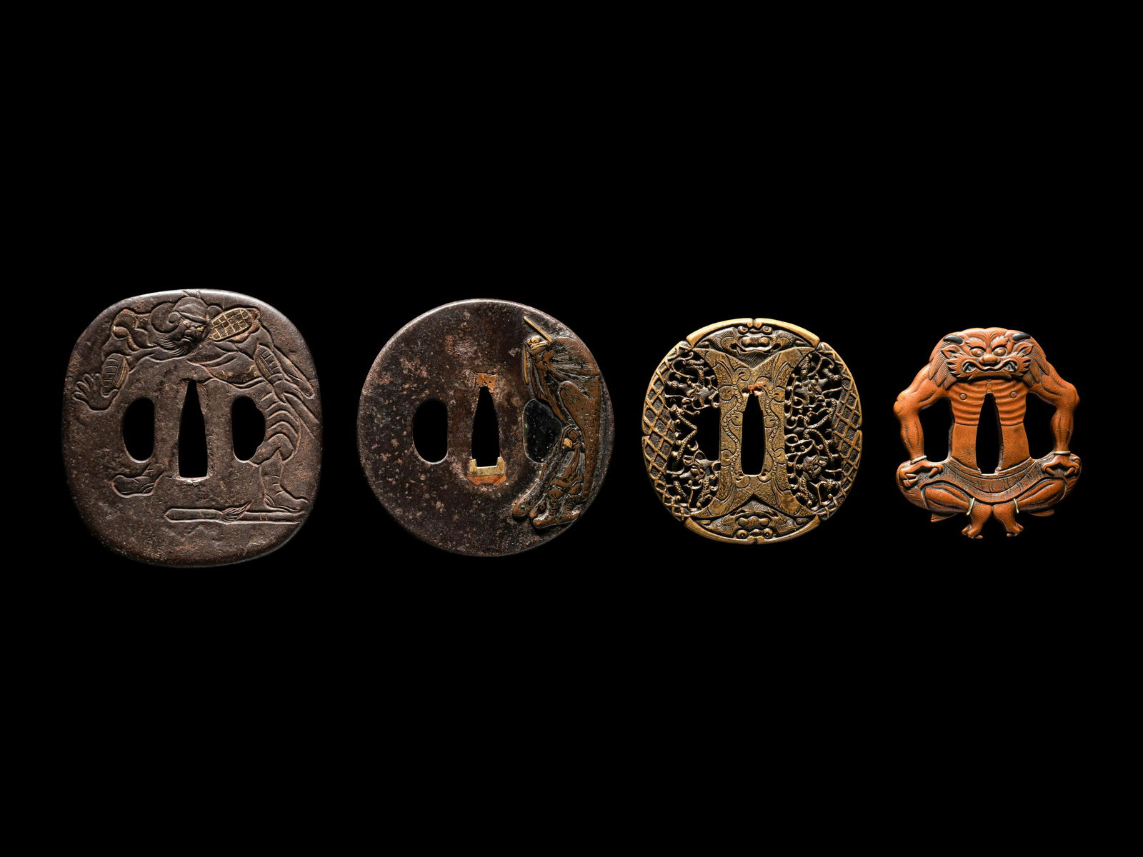 Four Japanese Metal Tsuba Length of largest 3 1/2 in., 9 cm. (1 of 4)