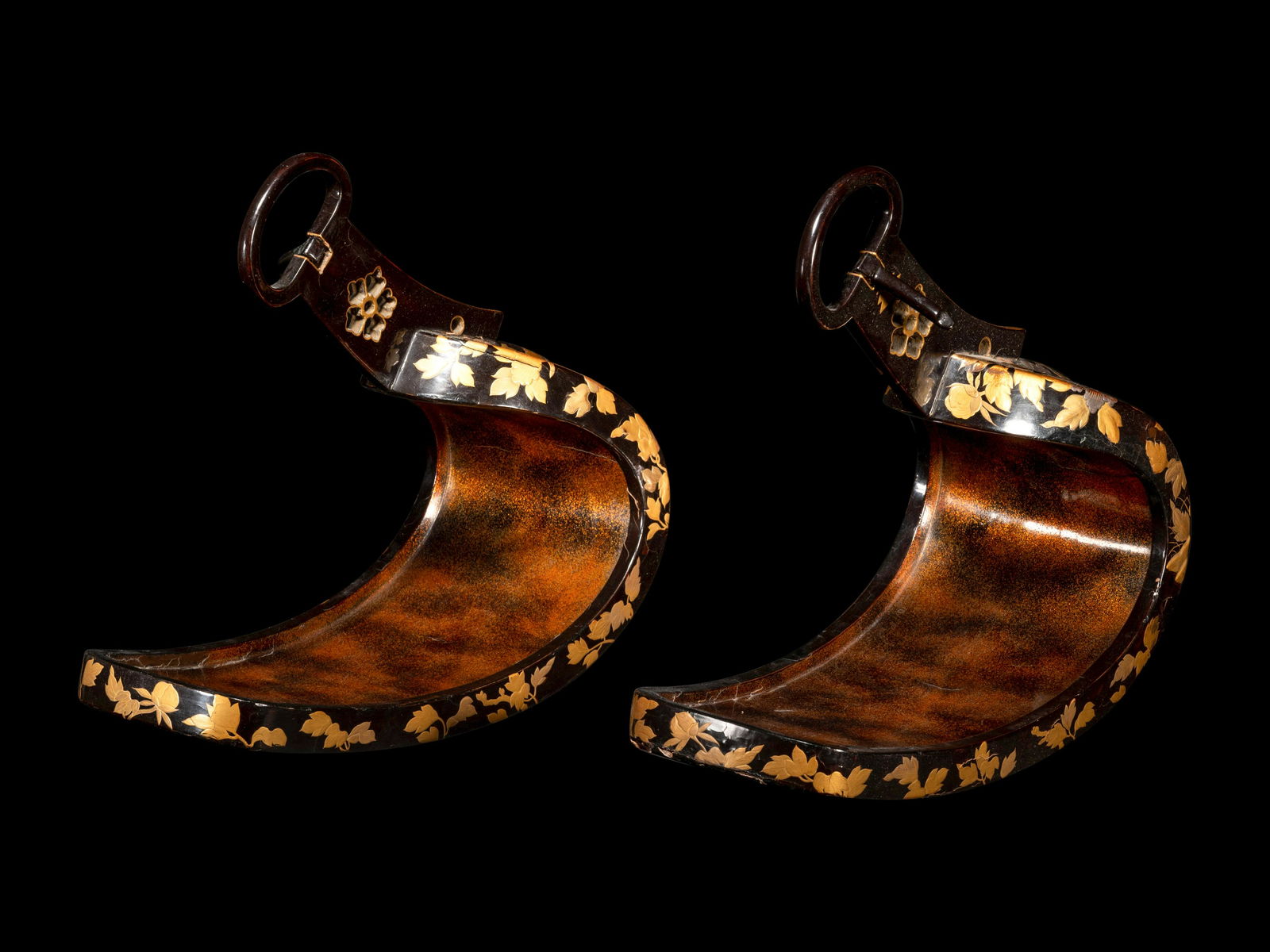A Pair of Japanese Gold and Black Lacquered Stirrups Height of each 11 in., 28 cm. (1 of 6)