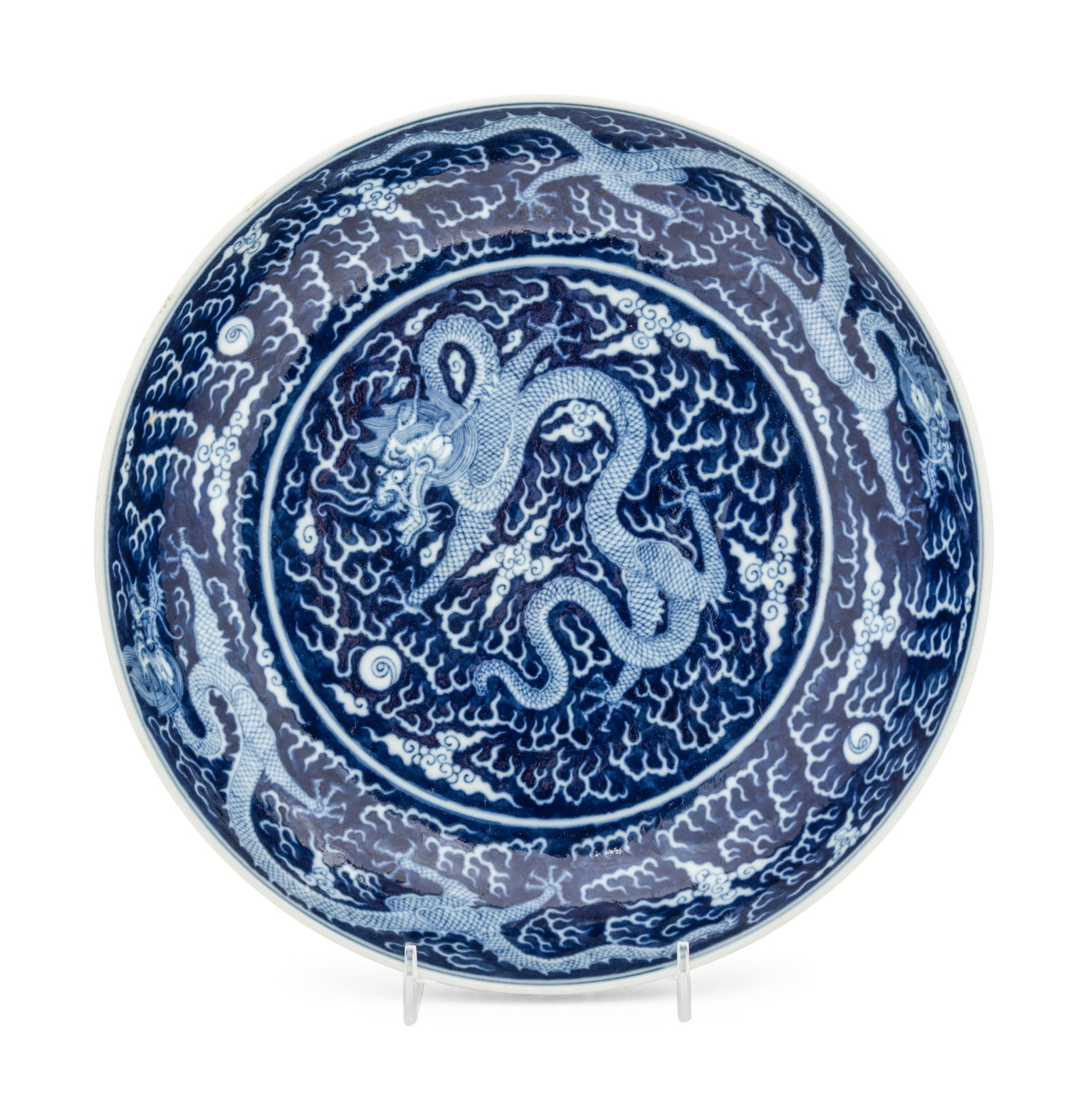 A Reverse-Decorated Blue and White Porcelain 'Dragon' Plate Diameter 10 3/4 in., 27.3 cm. (1 of 3)