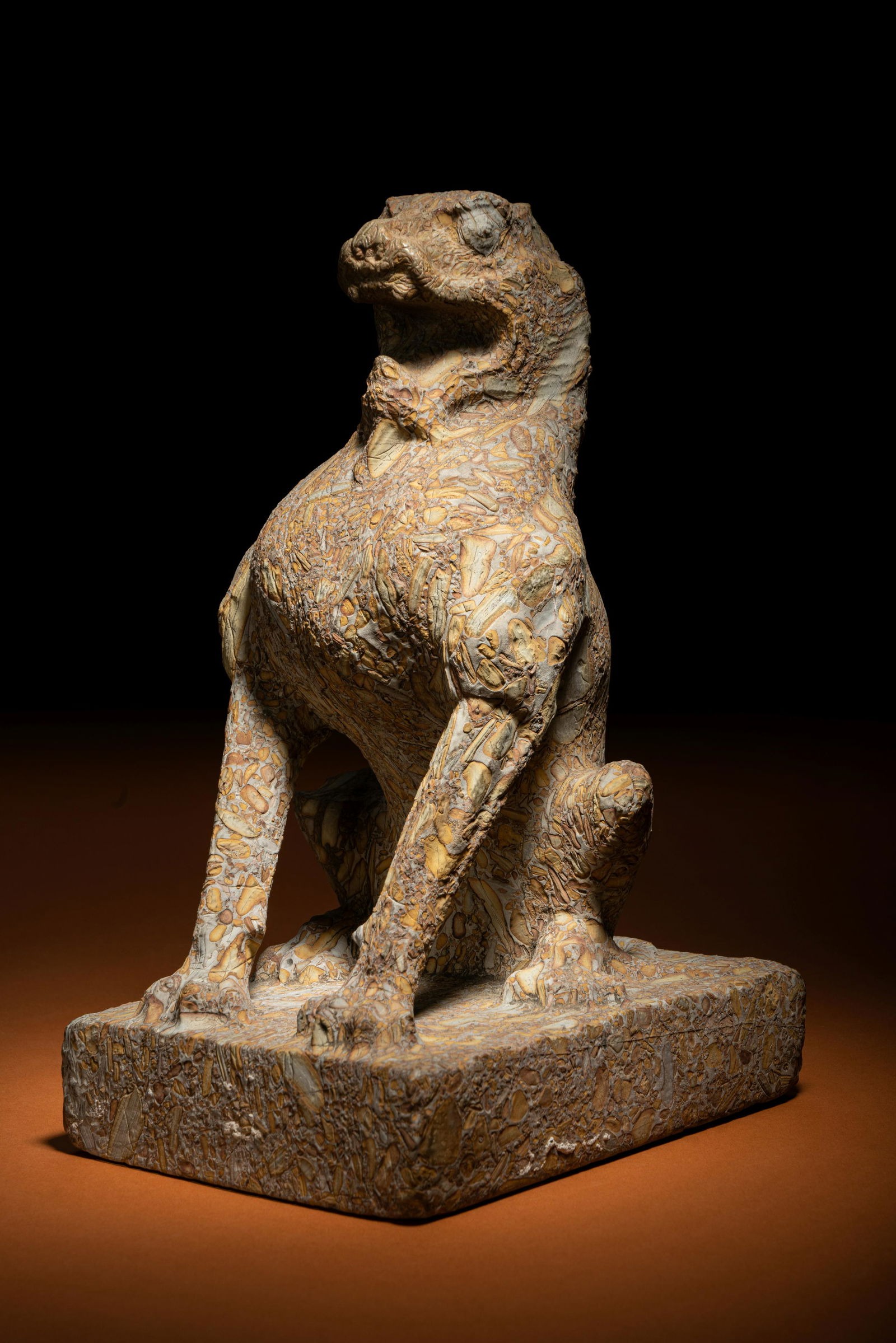 A Carved Puddingstone Figure of a Seated Lion Height 11 1/2 x width 5 1/2 in x length 7 1/4 in., (1 of 4)
