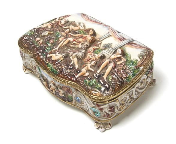 A Capodimonte Table Casket, Width 12 3/4 inches.: A Capodimonte Table Casket, the shaped rectangular hinged top with raised classical figural decoration. Width 12 3/4 inches.