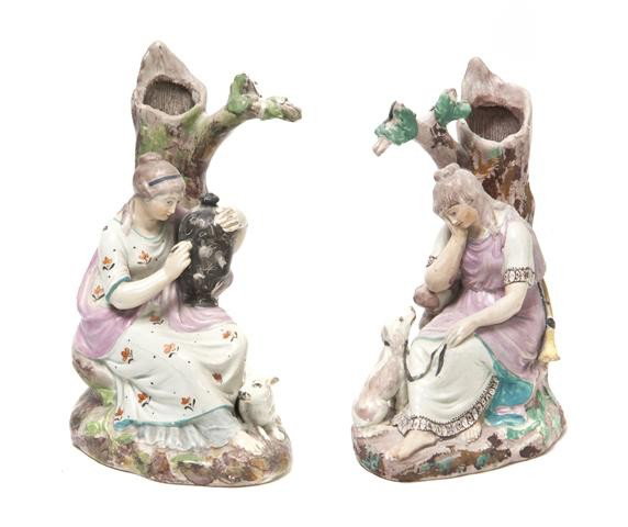 A Group of Two English Porcelain Figural Spill Vas: A Group of Two English Porcelain Figural Spill Vases, 19th century, one depicting a lady with a lamp, the other a lady with a dog. Height of first 8 inches. Property from the William H. Moore Trust, H
