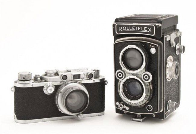 A Group of Two Vintage Cameras, Height of tallest : A Group of Two Vintage Cameras, eat set in a leather case. Height of tallest 7 1/2 inches. Property from the William H. Moore Trust, Hobe Sound, Florida