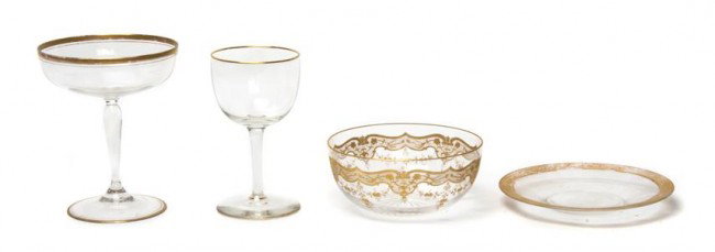 A Collection of Gilt Decorated Glassware, Height o: A Collection of Gilt Decorated Glassware, comprising 10 bowls, 11 saucers, 10 champagnes and 11 wines. Height of tallest 5 inches. Property from the William H. Moore Trust, Hobe Sound, Florida
