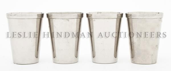 A Set of Steel Nesting Cups, Height 2 3/4 each.: A Set of Steel Nesting Cups, comprising four steel nesting cups together with a fitted zippered leather travelling case AER2 Germany embossed in gold on bottom of case. Height 2 3/4 each. Property fro