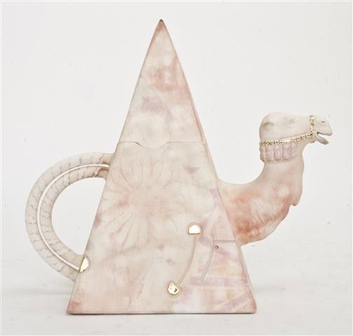 A Ceramic Pyramid Form Teapot, David B. Ward, Heig: A Ceramic Pyramid Form Teapot, David B. Ward, Camel Man, having C-form handle and cane form spout. Height 9 3/4 inches. Property from the Collection of Irma Ecksel, Nashville, Tennessee