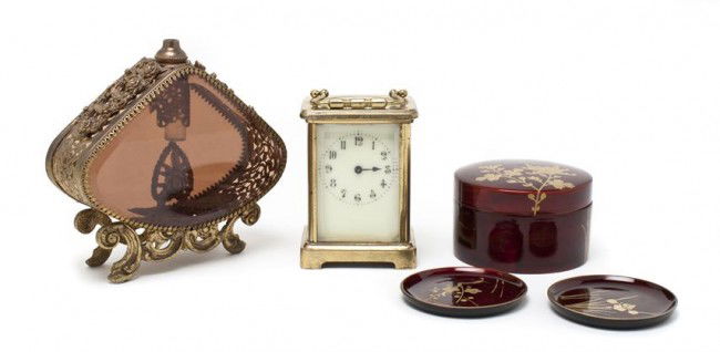 A Brass Carriage Clock, Height of first over handl: A Brass Carriage Clock, having time only movement, together with a gilt metal and glass bottle and a set of lacquered coasters. Height of first over handle 5 1/2 inches.