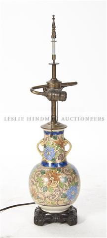 A Noritake Porcelain Vase, Height 10 1/2 inches.: A Noritake Porcelain Vase, of bottle form with applied gilt handles having allover foliate decoration, mounted as a lamp. Height 10 1/2 inches.