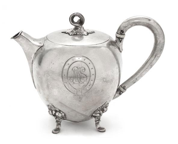 A German Silver Teapot, Gebruder Friedlander, Heig: A German Silver Teapot, Gebruder Friedlander, circa 1900, of ovoid form with ivory insulators; approximate weight overall 13.60 ozt. Height 5 3/4 inches. Property from the William H. Moore Trust, Hobe