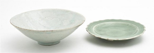 A Group of Two Chinese Celadon Glazed Porcelain Ar: A Group of Two Chinese Celadon Glazed Porcelain Articles, comprising a molded Song style dish and a celadon glazed bowl with lobed rim. Diameter of largest 6 7/8 inches. Property from the William H. M
