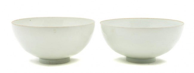 A Pair of Chinese Near White Glazed Bowls, Diamete: A Pair of Chinese Near White Glazed Bowls, each raised on a circular foot. Diameter 5 3/8 inches. Property from the William H. Moore Trust, Hobe Sound, Florida