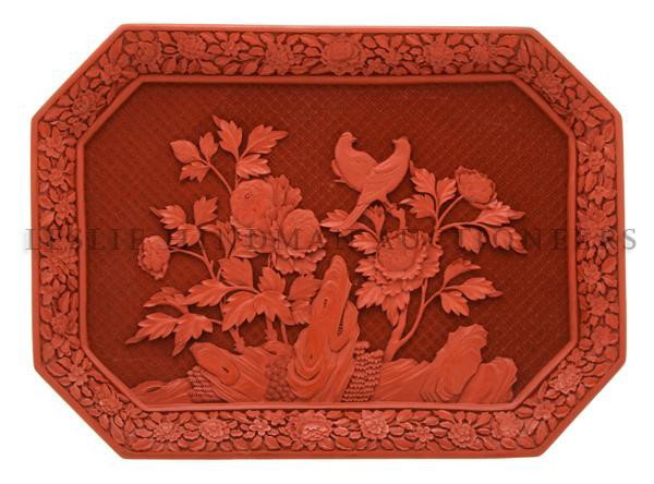 A Chinese Cinnabar Lacquer Tray, Height 10 1/2 x w: A Chinese Cinnabar Lacquer Tray, of rectangular form and depicting two birds atop flowering peonies with repetitive diaper pattern in the reserve. Height 10 1/2 x width 14 1/2 inches. Property from a