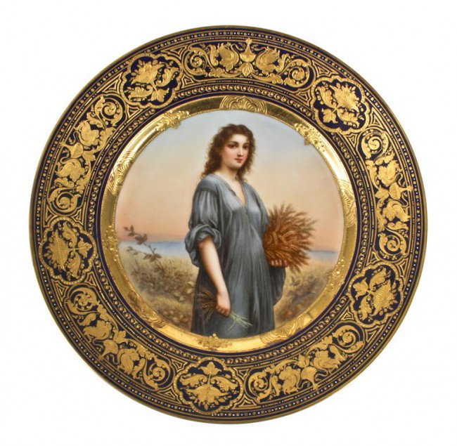 A Royal Vienna Porcelain Cabinet Plate, Diameter 9 3/4 : A Royal Vienna Porcelain Cabinet Plate, depicting a peasant girl carrying a wheat sheaf, signed Wagner. Diameter 9 3/4 inches.