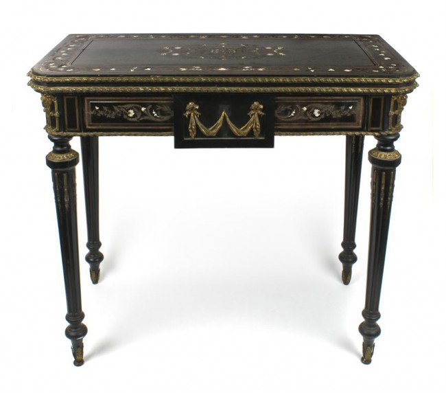 A Napoleon III Ebonized Wood Games Table, Height 30 x w: A Napoleon III Ebonized Wood Games Table, the rectangular top with inlaid brass, mother-of-pearl and ivory decoration, having gilt metal mounts throughout, raised on four fluted tapering legs. Height 
