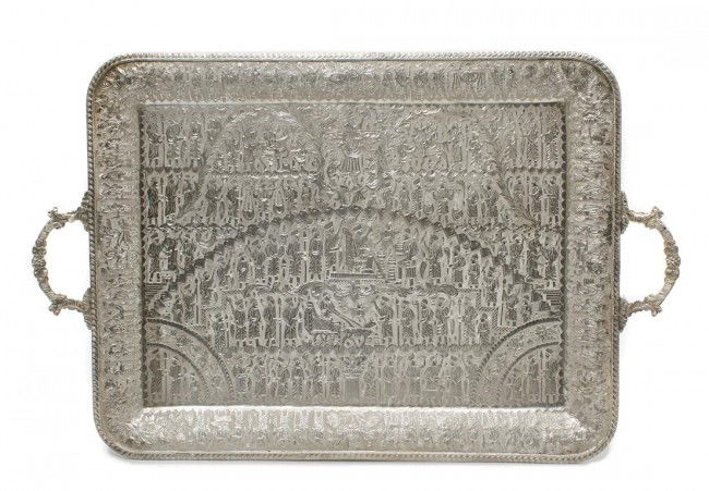 An Iranian Silver Serving Tray, Width of tray between h: An Iranian Silver Serving Tray, of rectangular form with two handles, depicting an historical scene from ancient Persia; approximate weight 88.50 ozt. Width of tray between handles 24 3/4 inches.