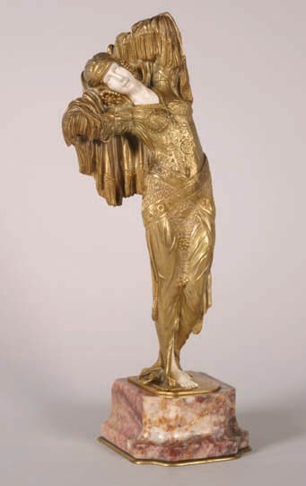 Demetre Chiparus,: Demetre Chiparus, Odalisque, an art deco bronze and ivory figure, first half of the 20th century, the lady modeled standing, hands clasped behind her head, set on a marble pedestal. The pedestal inscr