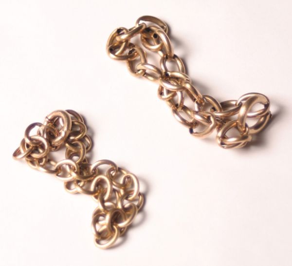 A Collection of Three Bracelets,: featuring two Georgian yellow gold link bracelets, and one silver link bracelet, all weighing approximately 15.00 dwts. total.
