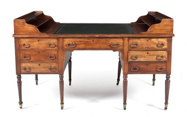 A Mahogany George Washington Desk, Height 35 x widt: A Mahogany George Washington Desk, having a rectangular top with leather inset writing surface and twin letter racks, each side with one long and six short drawers, raised on fluted tapering legs endi