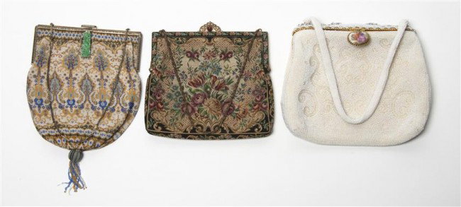 A Sterling Silver and Jade Beaded Handbag, Height : A Sterling Silver and Jade Beaded Handbag, having stylized foliate decoration, together with a Walborg beaded and porcelain inset handbag and two petit point handbags. Height of first 6 x width 5 1/2 