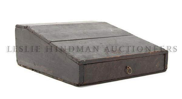 A Civil War Era Soldier's Field Desk, Height 5 1/2: A Civil War Era Soldier's Field Desk, having a rectangular top over the writing slope above a single drawer with ring pull. Height 5 1/2 x width 12 1/2 x depth 15 3/4 inches.